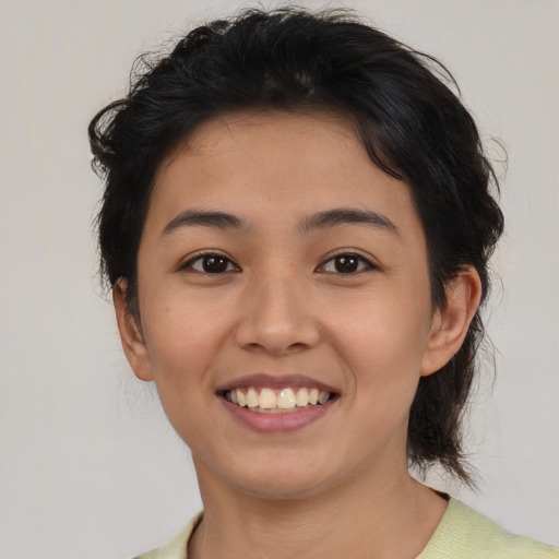 Joyful asian young-adult female with medium  brown hair and brown eyes