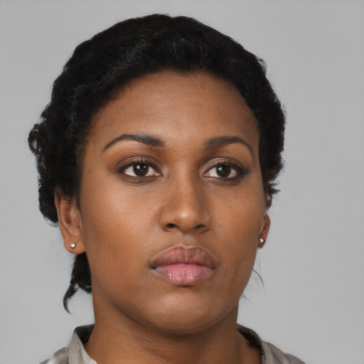 Neutral black young-adult female with short  black hair and brown eyes