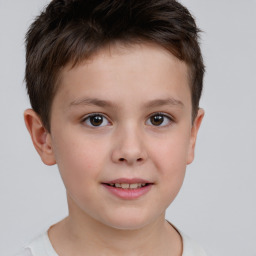 Joyful white child male with short  brown hair and brown eyes