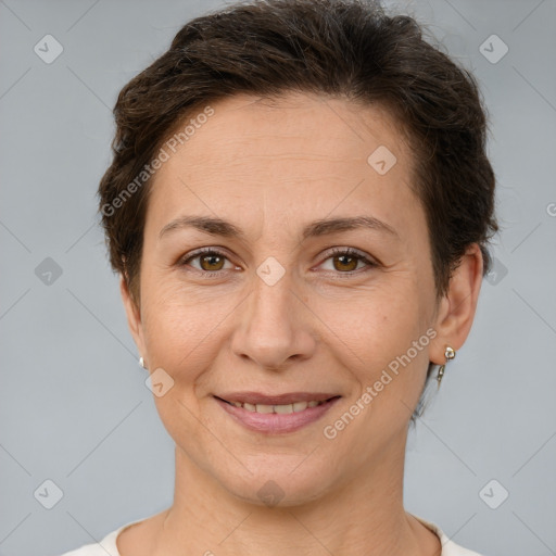 Joyful white adult female with short  brown hair and brown eyes