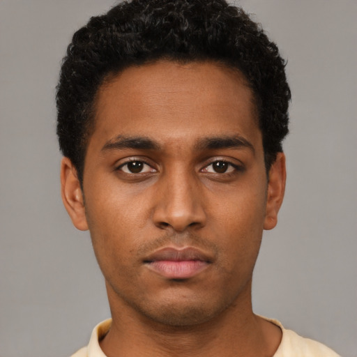 Neutral black young-adult male with short  brown hair and brown eyes