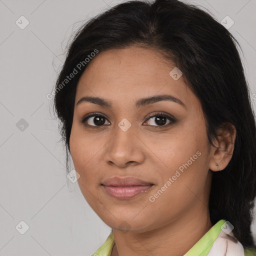 Joyful latino young-adult female with medium  brown hair and brown eyes