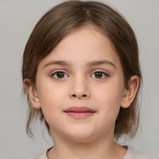 Joyful white child female with medium  brown hair and brown eyes