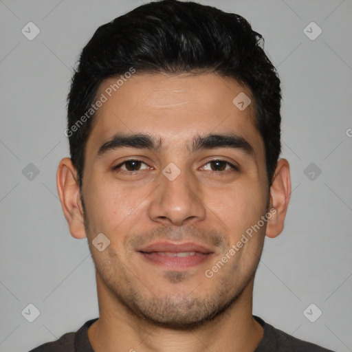 Joyful white young-adult male with short  black hair and brown eyes