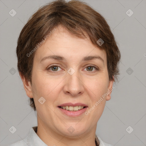 Joyful white adult female with short  brown hair and grey eyes