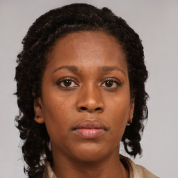 Neutral black young-adult female with long  brown hair and brown eyes