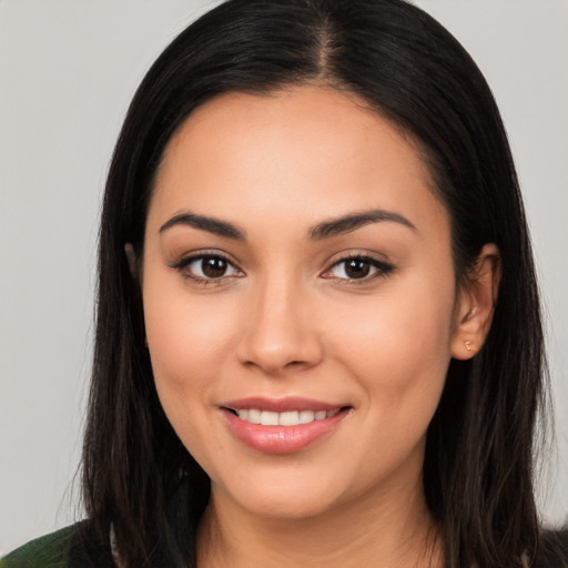 Joyful white young-adult female with long  black hair and brown eyes