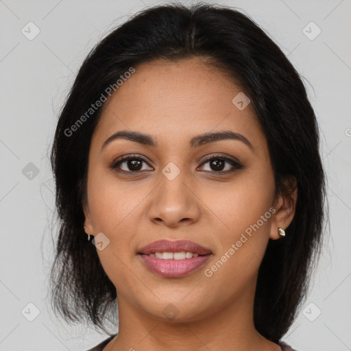 Joyful latino young-adult female with medium  brown hair and brown eyes