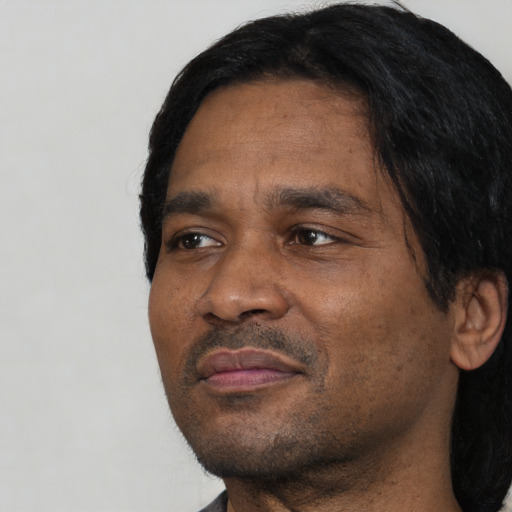 Neutral black adult male with short  black hair and brown eyes