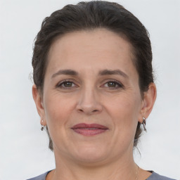 Joyful white adult female with short  brown hair and brown eyes