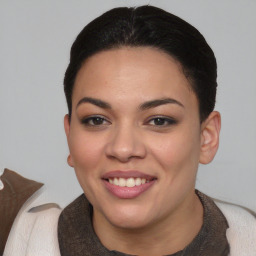 Joyful latino young-adult female with short  brown hair and brown eyes