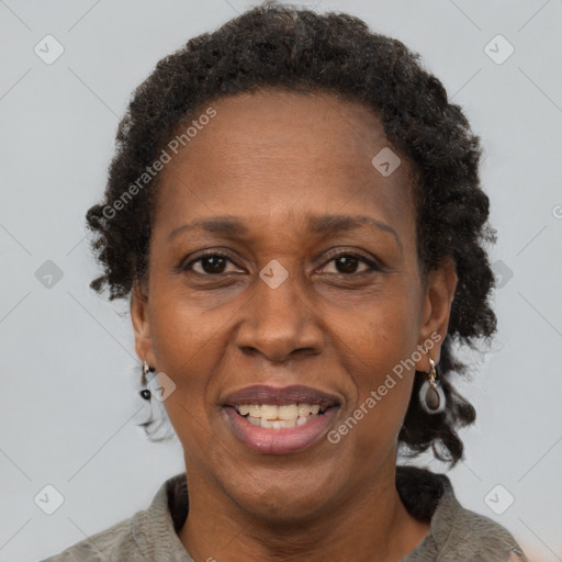 Joyful black adult female with short  brown hair and brown eyes