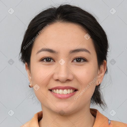 Joyful white young-adult female with medium  brown hair and brown eyes