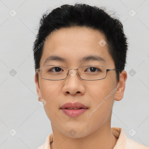 Joyful asian young-adult male with short  brown hair and brown eyes