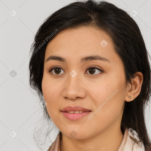 Joyful asian young-adult female with long  brown hair and brown eyes