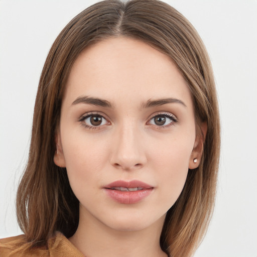 Neutral white young-adult female with long  brown hair and brown eyes