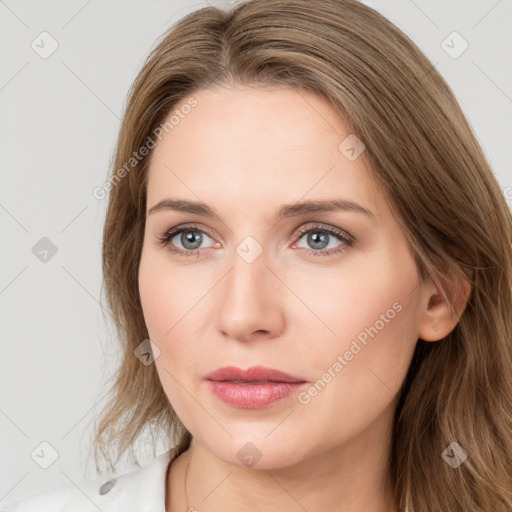 Neutral white young-adult female with long  brown hair and brown eyes