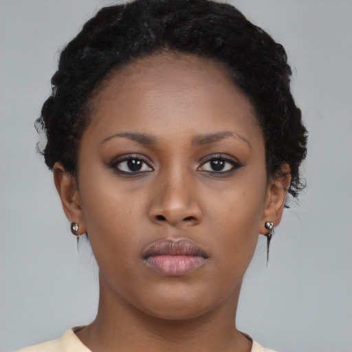 Neutral black young-adult female with short  brown hair and brown eyes