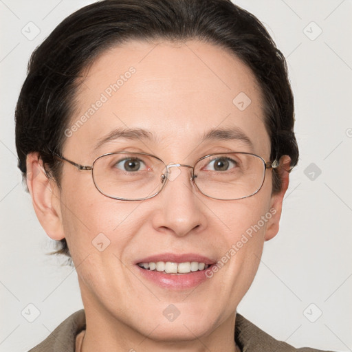 Joyful white adult female with short  brown hair and grey eyes