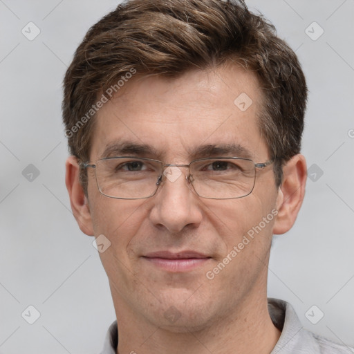 Joyful white adult male with short  brown hair and grey eyes