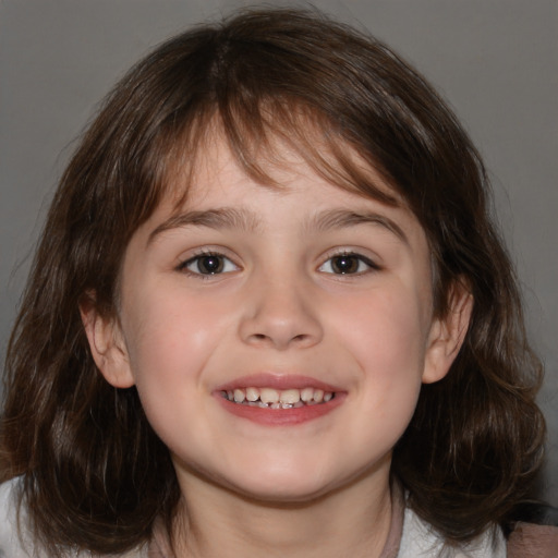 Joyful white child female with medium  brown hair and brown eyes