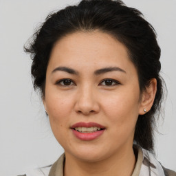 Joyful asian young-adult female with medium  brown hair and brown eyes