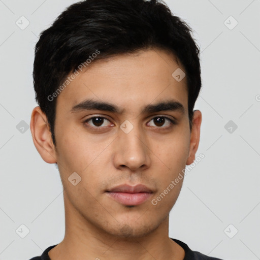 Neutral latino young-adult male with short  black hair and brown eyes