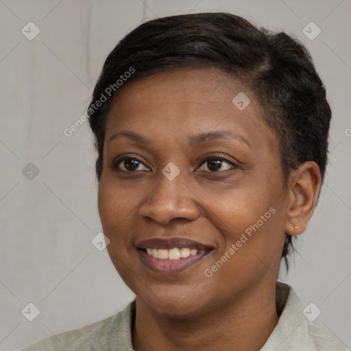 Joyful black adult female with short  brown hair and brown eyes