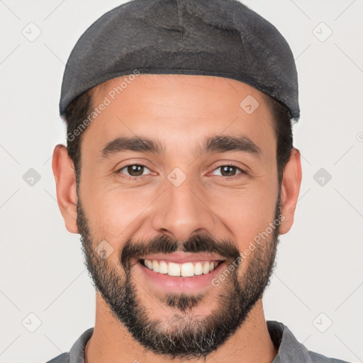 Joyful white young-adult male with short  black hair and brown eyes