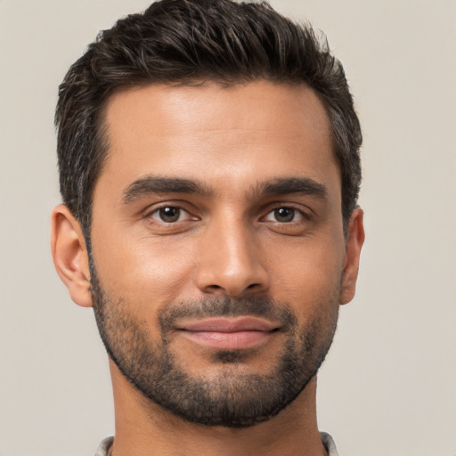 Joyful white young-adult male with short  brown hair and brown eyes