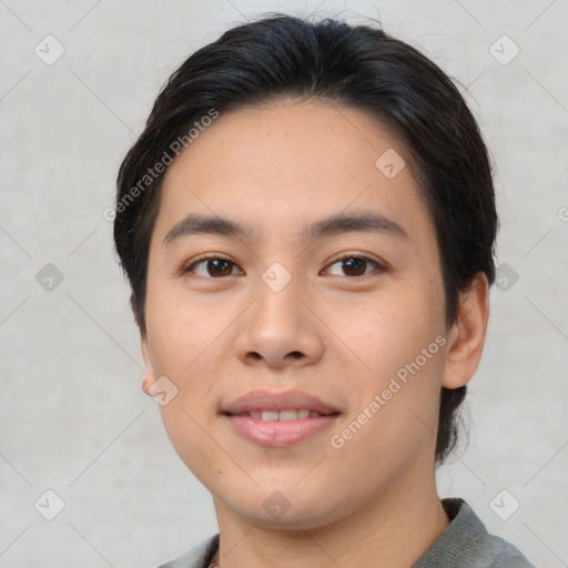 Joyful asian young-adult male with short  brown hair and brown eyes