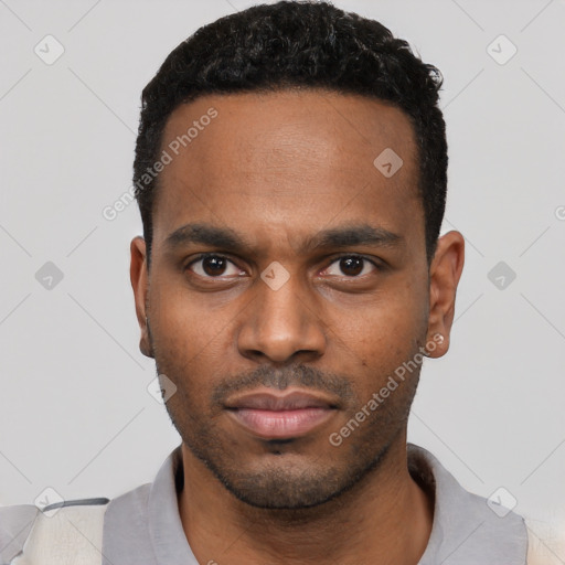 Neutral black young-adult male with short  black hair and brown eyes