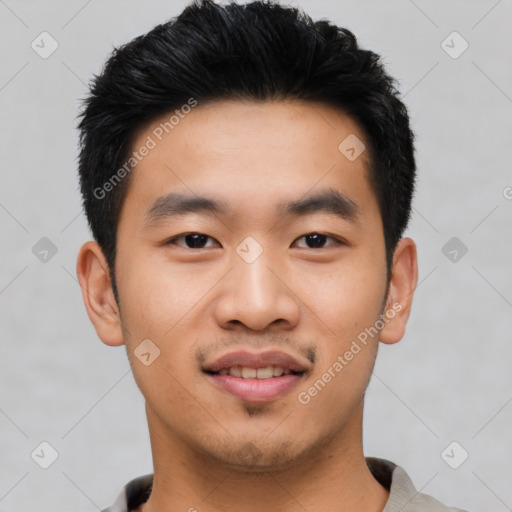 Joyful asian young-adult male with short  black hair and brown eyes