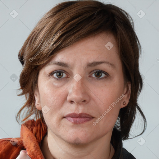 Joyful white adult female with medium  brown hair and brown eyes