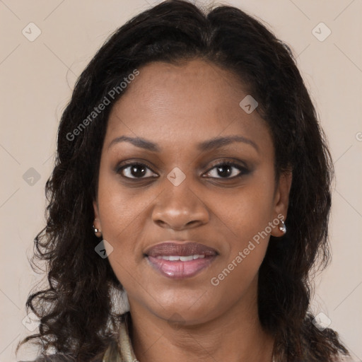 Joyful black young-adult female with long  brown hair and brown eyes