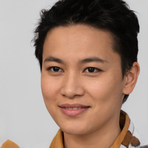 Joyful asian young-adult female with short  brown hair and brown eyes