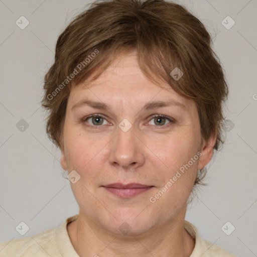 Joyful white adult female with medium  brown hair and grey eyes