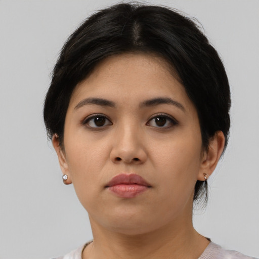 Neutral asian young-adult female with medium  brown hair and brown eyes