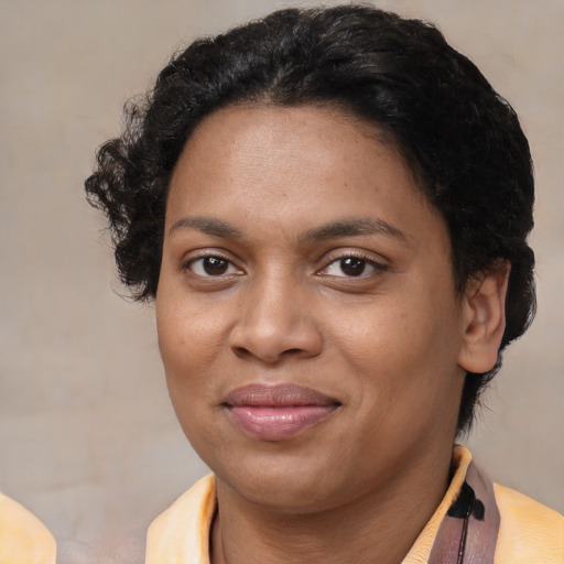 Joyful latino adult female with short  brown hair and brown eyes