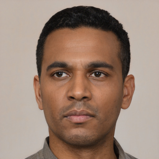 Neutral latino young-adult male with short  black hair and brown eyes
