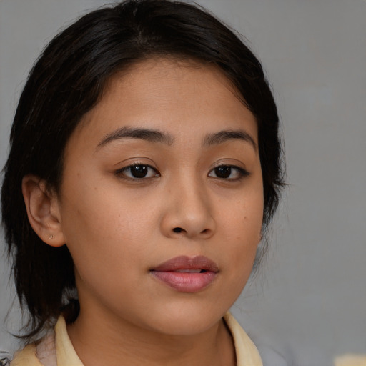 Neutral latino young-adult female with medium  brown hair and brown eyes