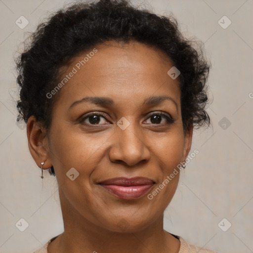 Joyful black adult female with short  brown hair and brown eyes