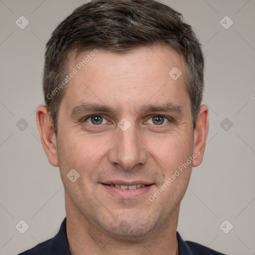 Joyful white adult male with short  brown hair and brown eyes