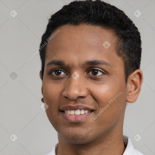 Joyful black young-adult male with short  black hair and brown eyes