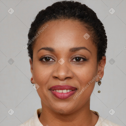 Joyful black young-adult female with short  brown hair and brown eyes