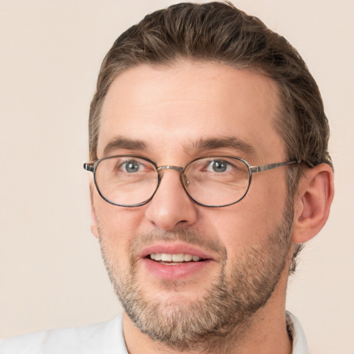 Joyful white adult male with short  brown hair and brown eyes