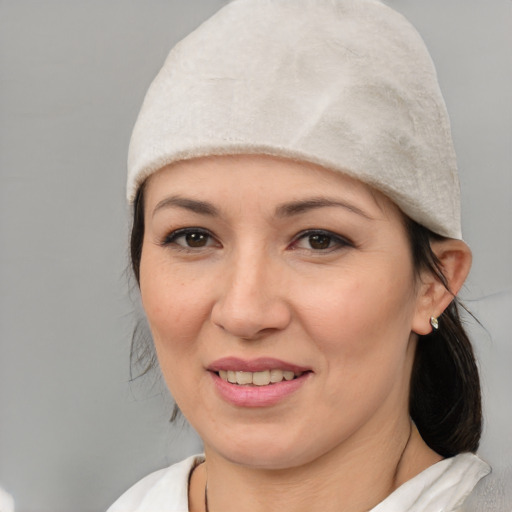 Joyful white young-adult female with medium  black hair and brown eyes