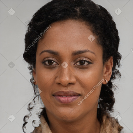 Joyful black young-adult female with long  brown hair and brown eyes