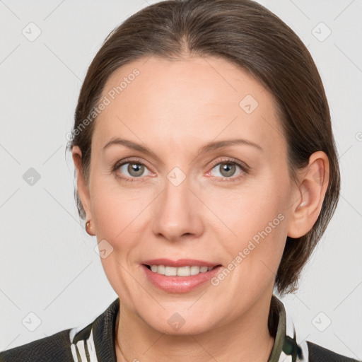 Joyful white adult female with medium  brown hair and grey eyes