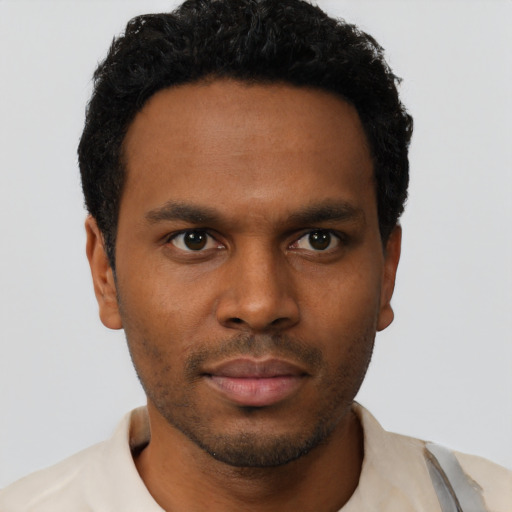 Neutral black young-adult male with short  black hair and brown eyes